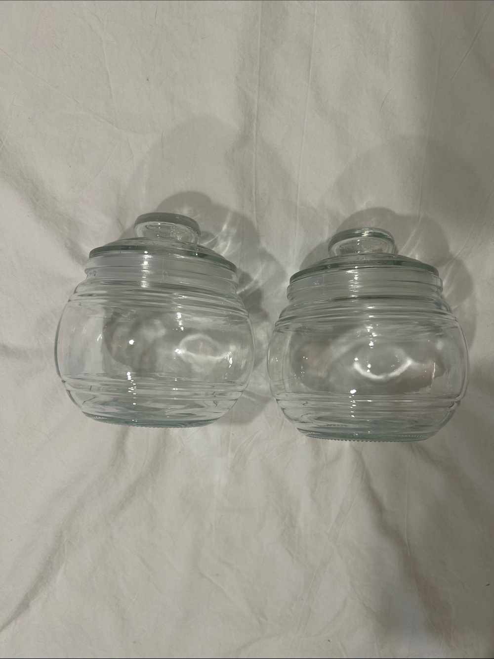 Two glass jars with sealed lids.